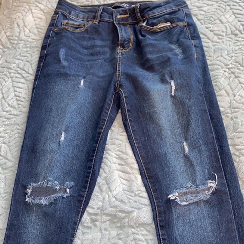 blue ripped jeans